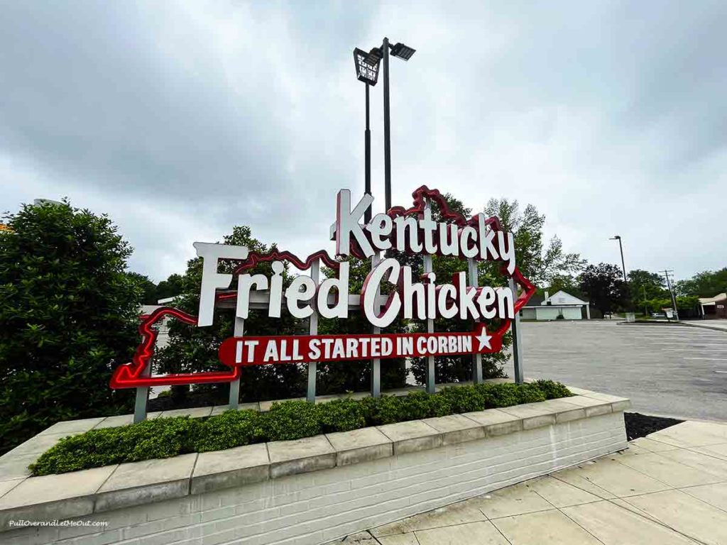 a neon sign that says Kentucky Fried Chicken