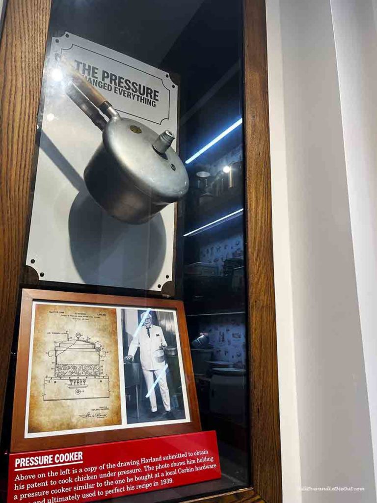 an old pressure cooker in a museum showcase