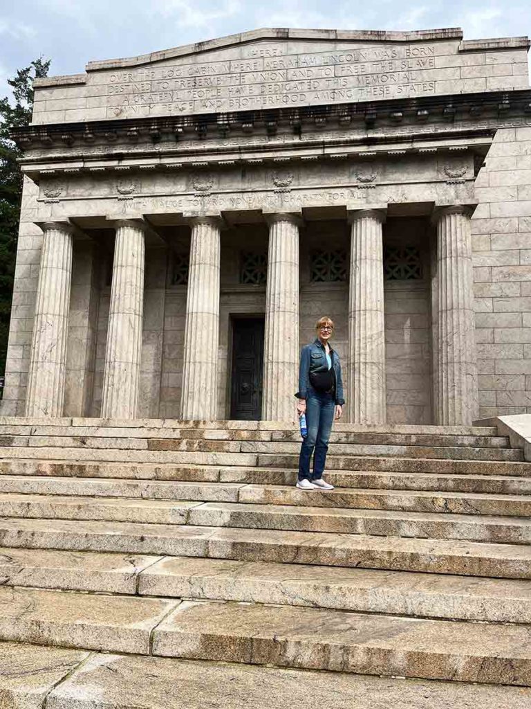 a woman standing on cement steps