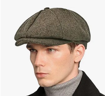 a man wearing a newsboy cap