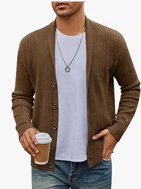 a man in a brown sweater holding a cup of coffee