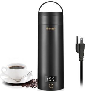 a portable travel kettle next to a cup of coffee