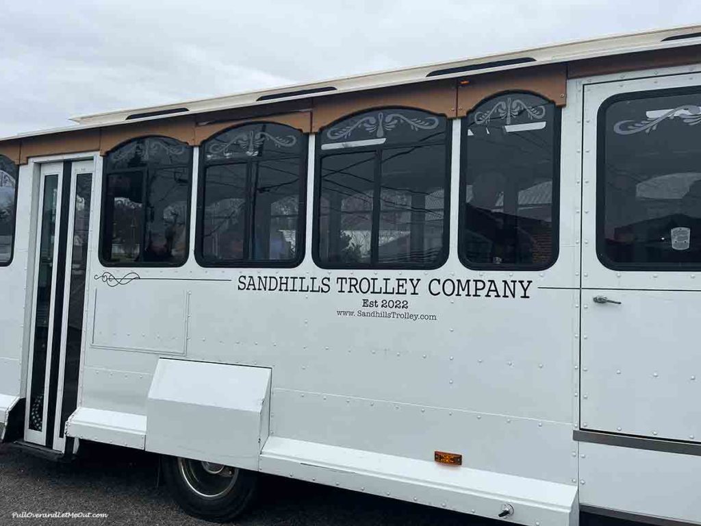 The side of a Sandhills Trolley Company tour bus