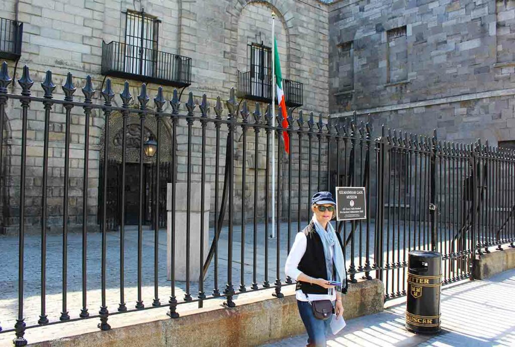 a woman outside the gates at Kilmainham Gaol Dublin