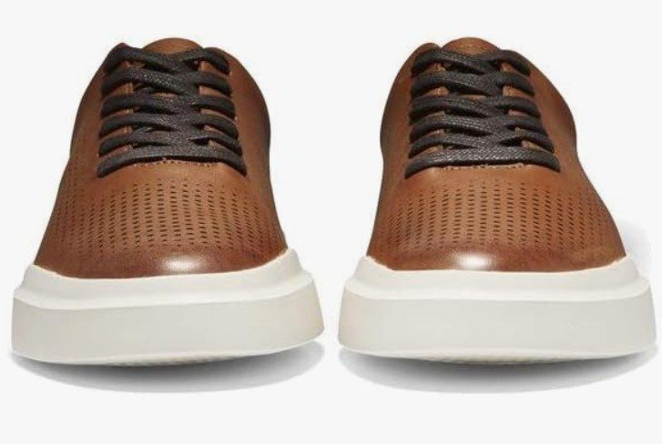 a light brown pair of Cole Haan Grandpro shoes