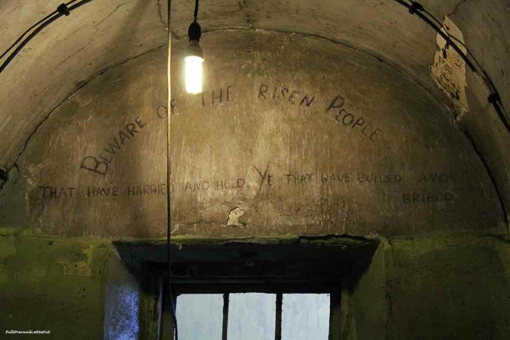 some graffiti on a prison wall