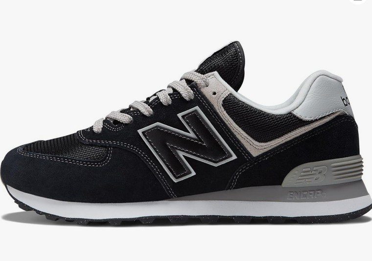 a black pair of New Balance 574 sneakers