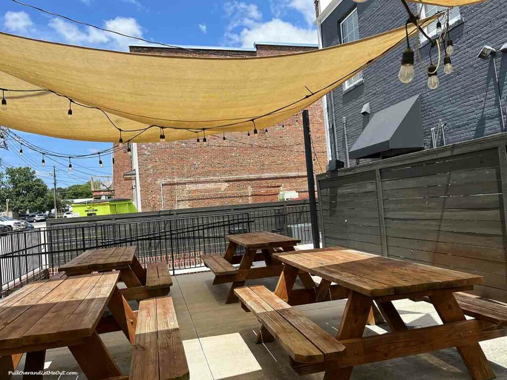 a patio with picnic tables