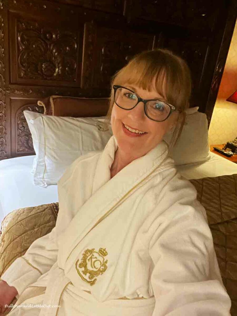 a woman in a hotel bathrobe