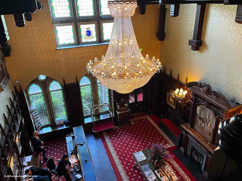 a chandelier overlooking a lobby in a hotel