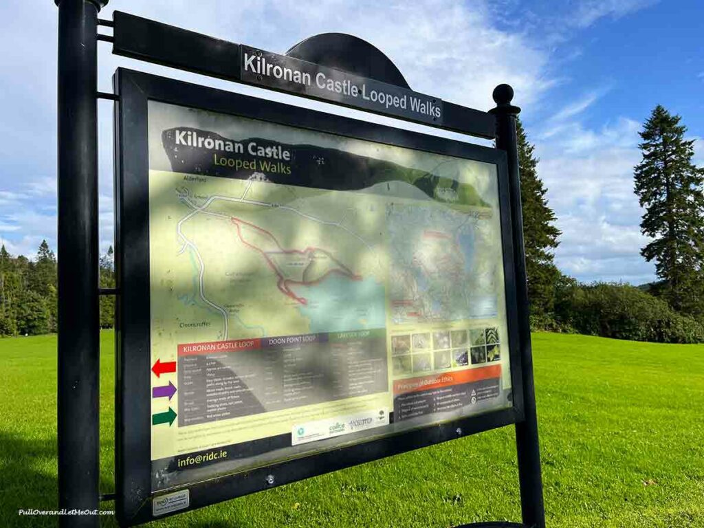a sign with walking trails displayed