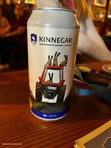 a can of craft brew beer with rabbits on a tractor on the can