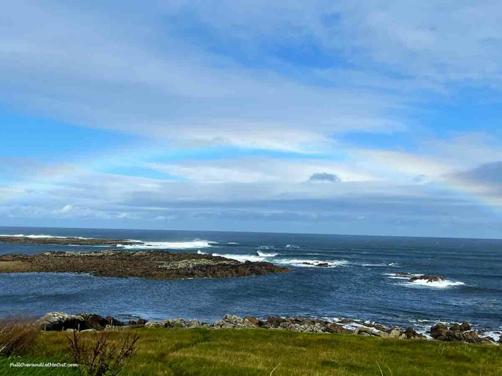 a rainbow on the coast