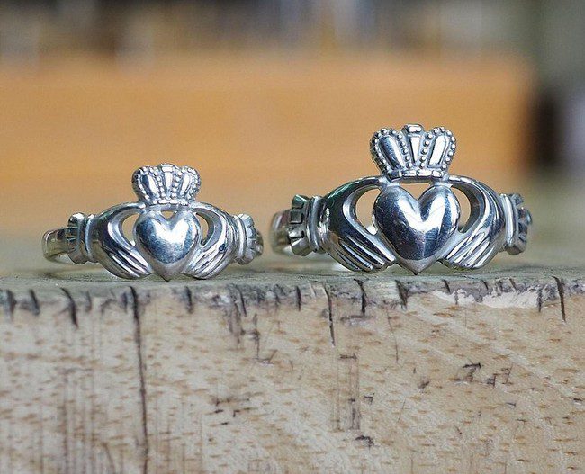 a woman's and a man's Claddagh ring