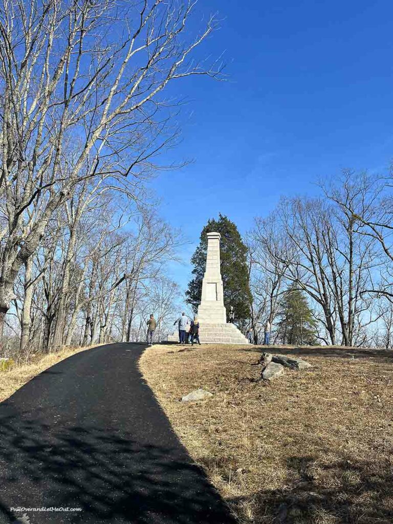 an marble monument on a hill
